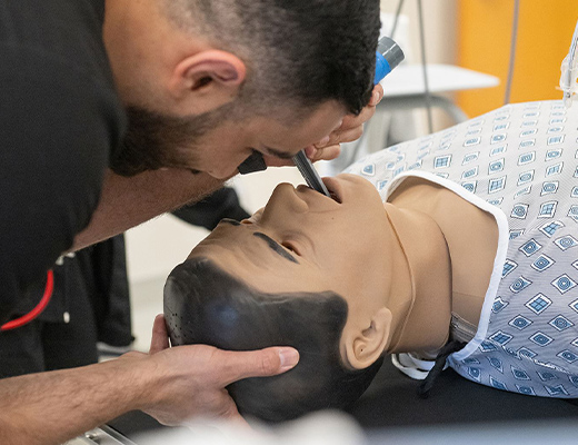 Student intibating manikin